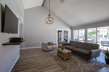 a living room with a couch and two chairs